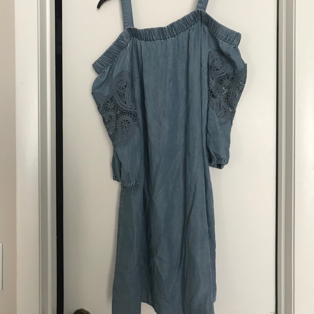 A blue off the shoulder dress.